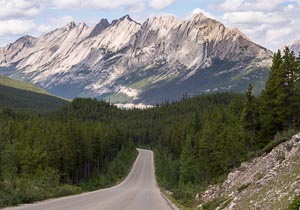 Majestic Mountains rise high above Medicine lake, AB, Canada, Aug 2012