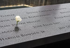 World Trade Center Memorial names with a birthday white rose, NYC, NY, USA, Dec 2014
